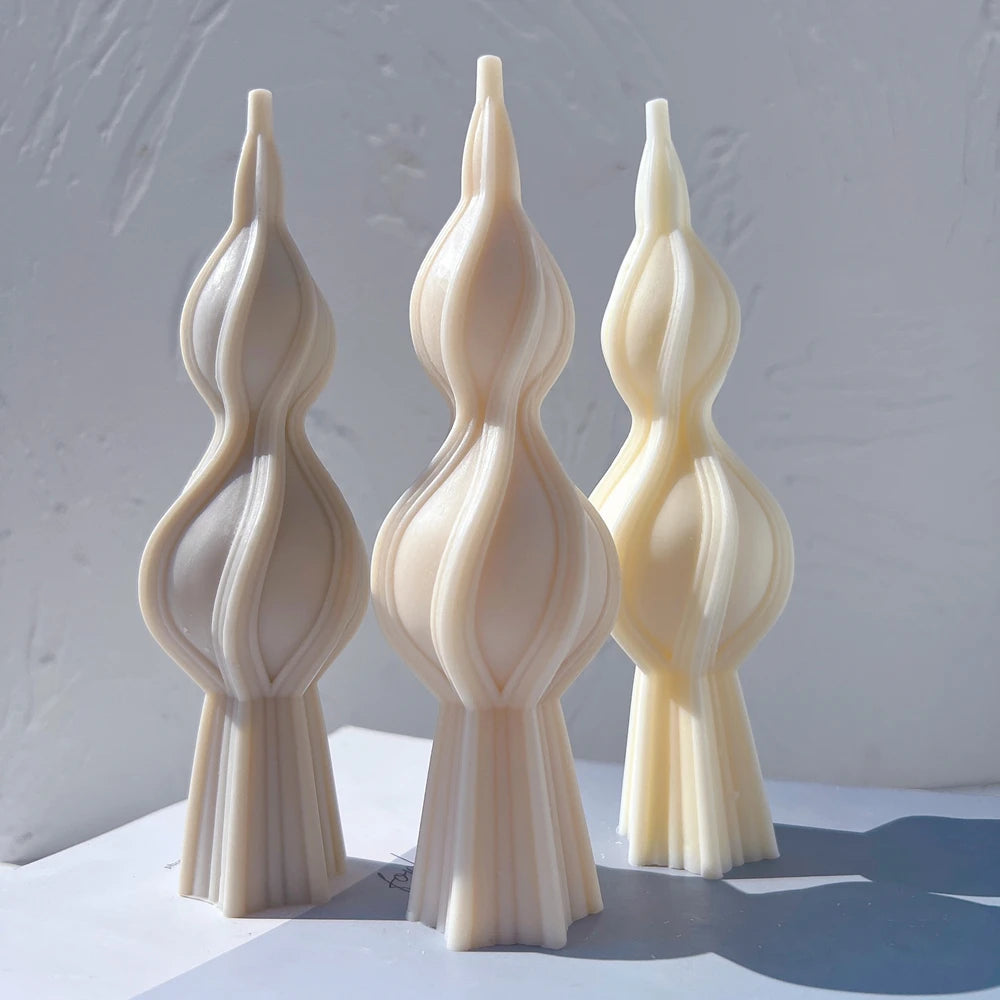 Three double-bulb twisted spindle candle castings