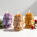 Lilac cream and yellow paired-bell candles with holly details
