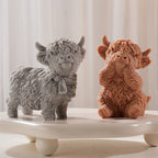 Standing and seated Highland cow candle figures