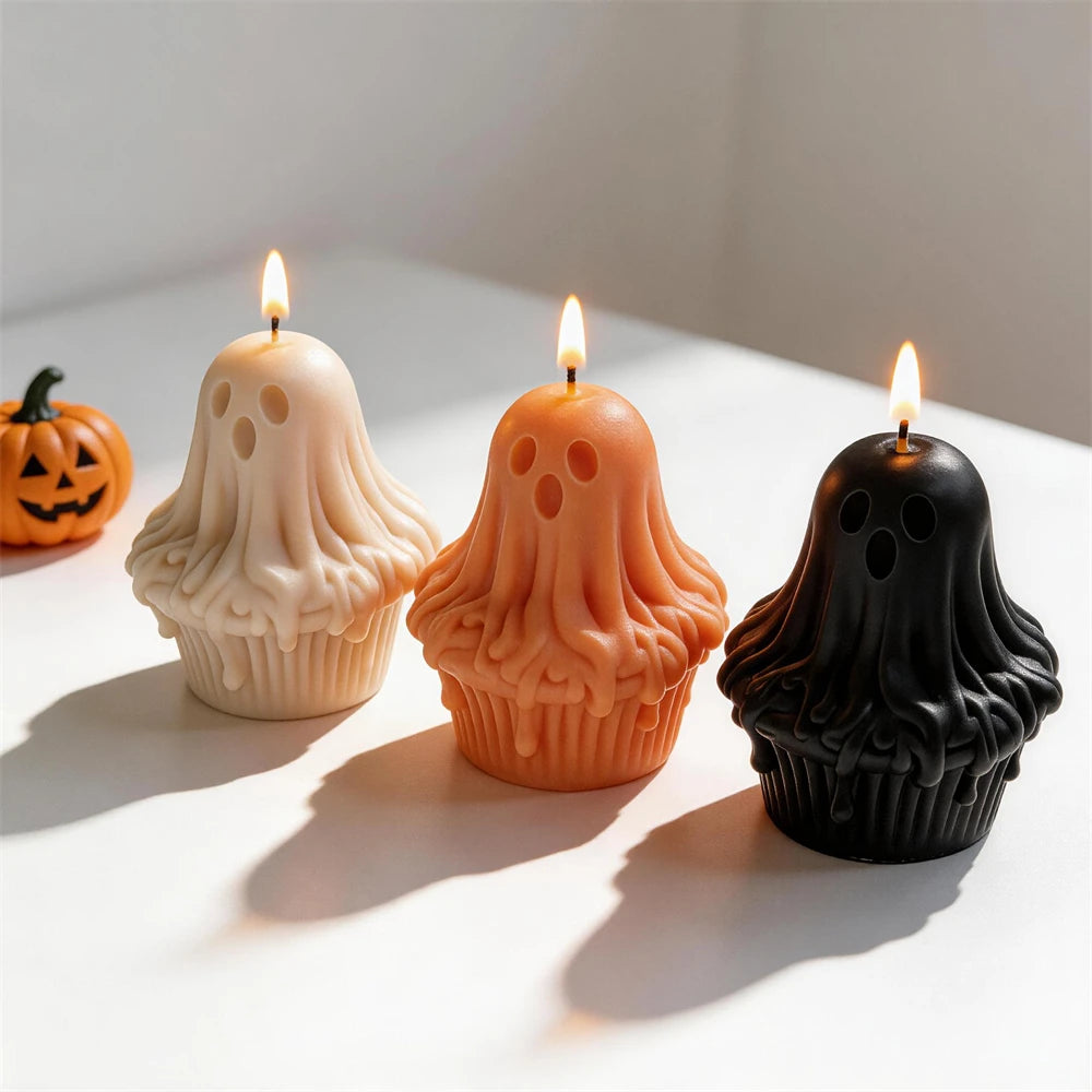 Three ghost cupcake castings with round eyes and open mouths