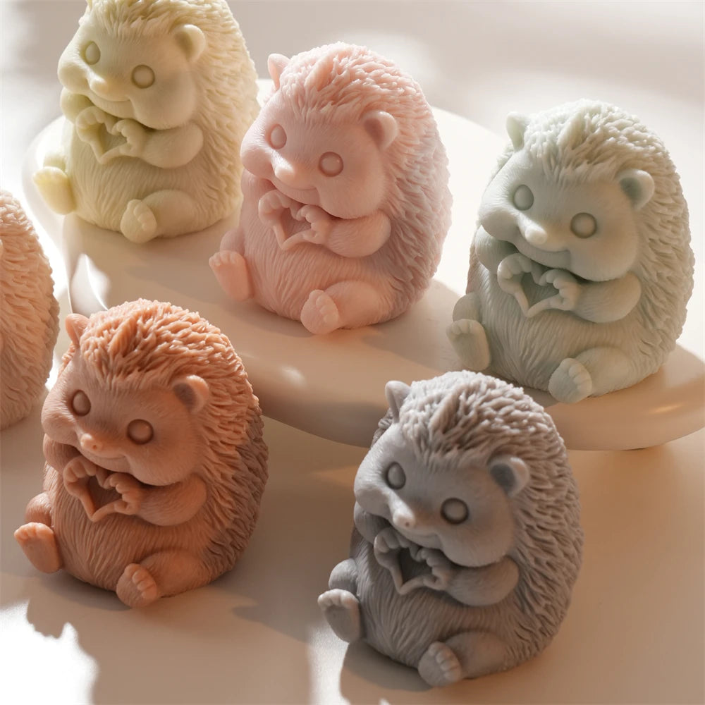 Five hedgehog castings with paws forming hearts
