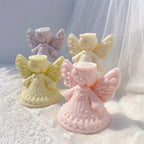 Halo angel candles with layered feather wings and dotted flared gowns