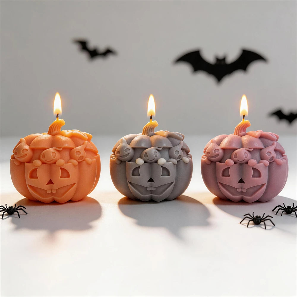 Orange, gray and lilac ghost-topped jack-o'-lantern candle examples