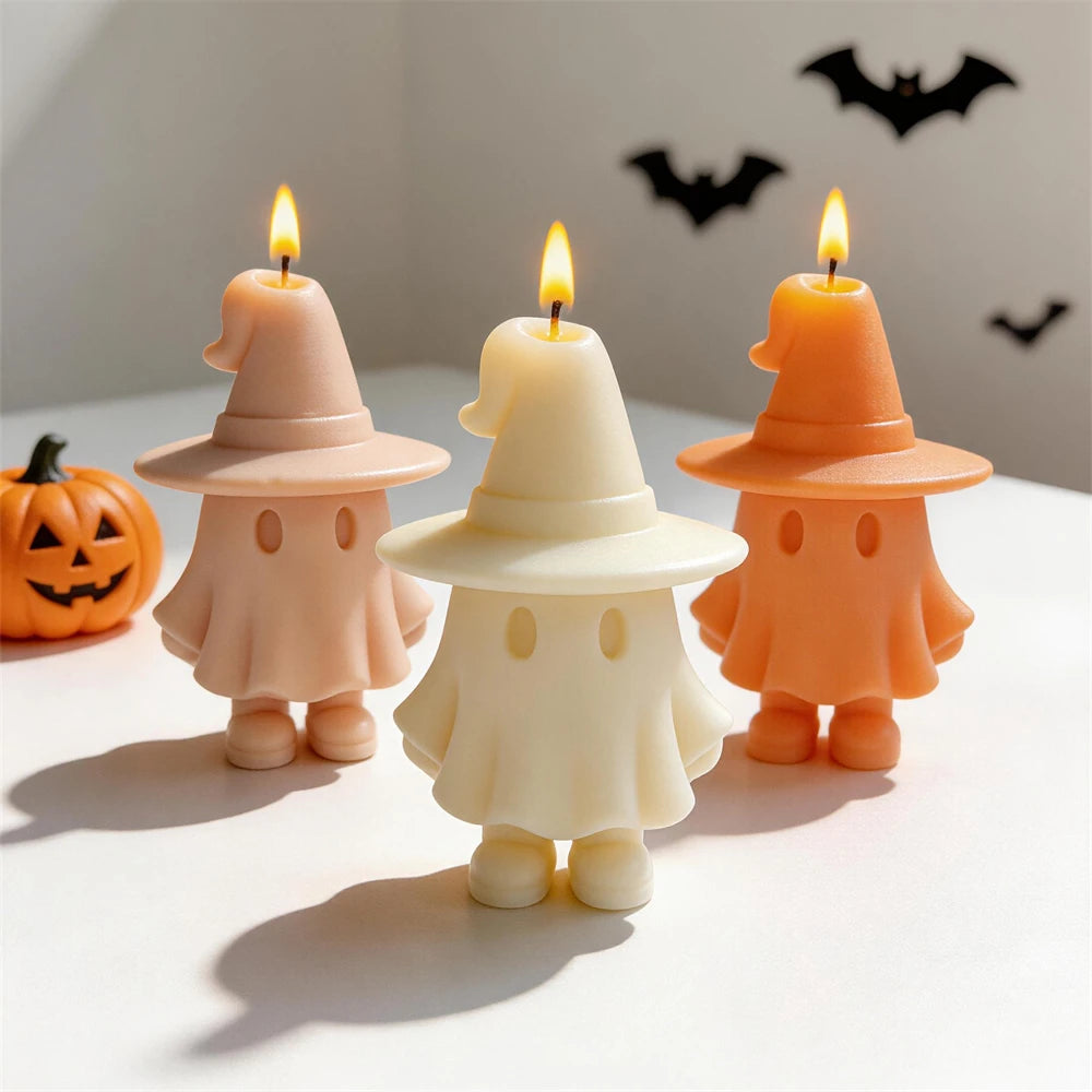 Peach cream and orange ghost candles with broad witch hats