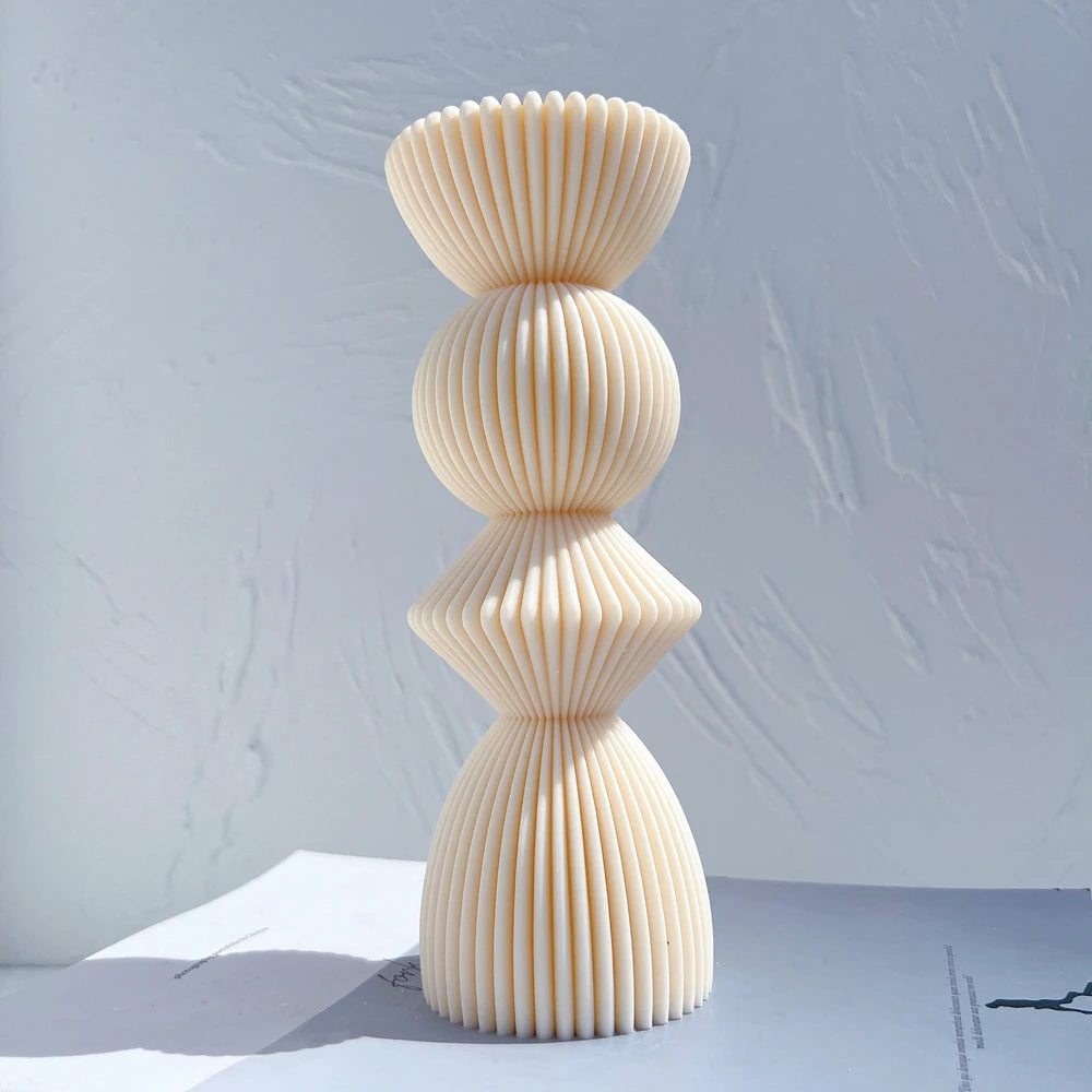 Single large stacked geometric casting with a diamond-like middle section