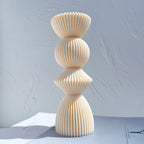Single large stacked geometric casting with a diamond-like middle section