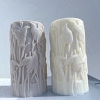 Gray and cream bird-relief pillars viewed from the front