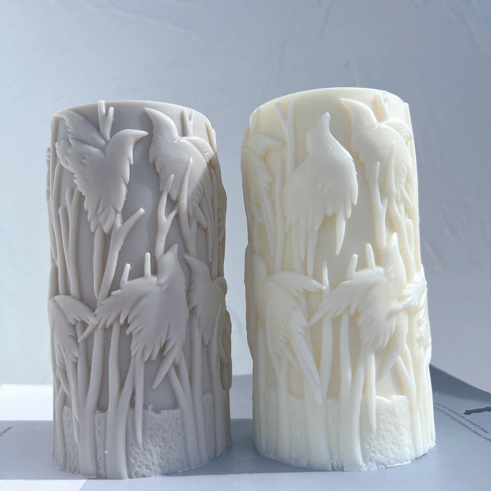 Gray and cream bird-relief pillars viewed from the front