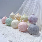 Angled group showing sculpted scenes on capped bauble shapes