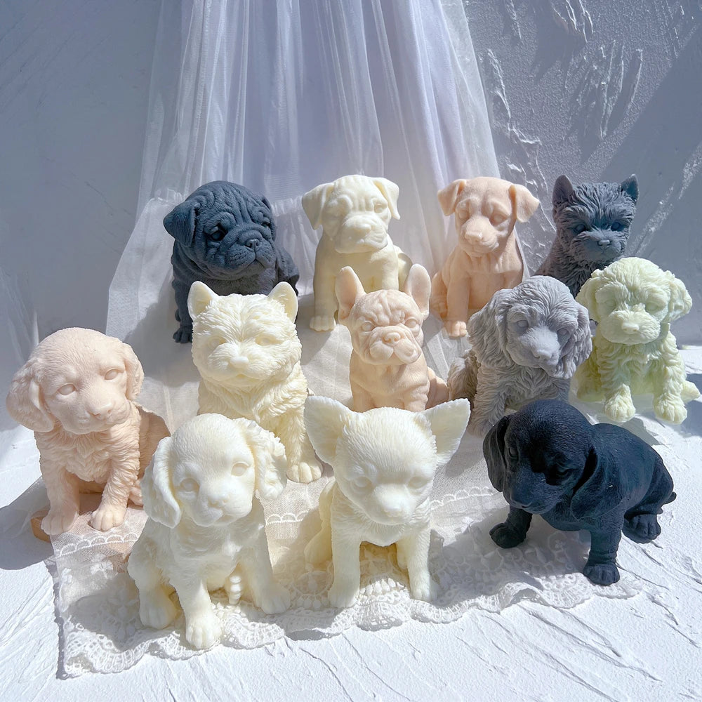 Assorted dog and puppy figurine candles in pastel and dark colors