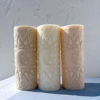 Cream and peach moon mandala pillars with pointed line patterns