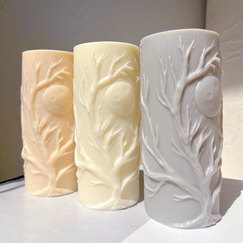 Three tree-relief pillar castings viewed from the front