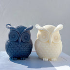 Blue and cream owl candles with large round eyes