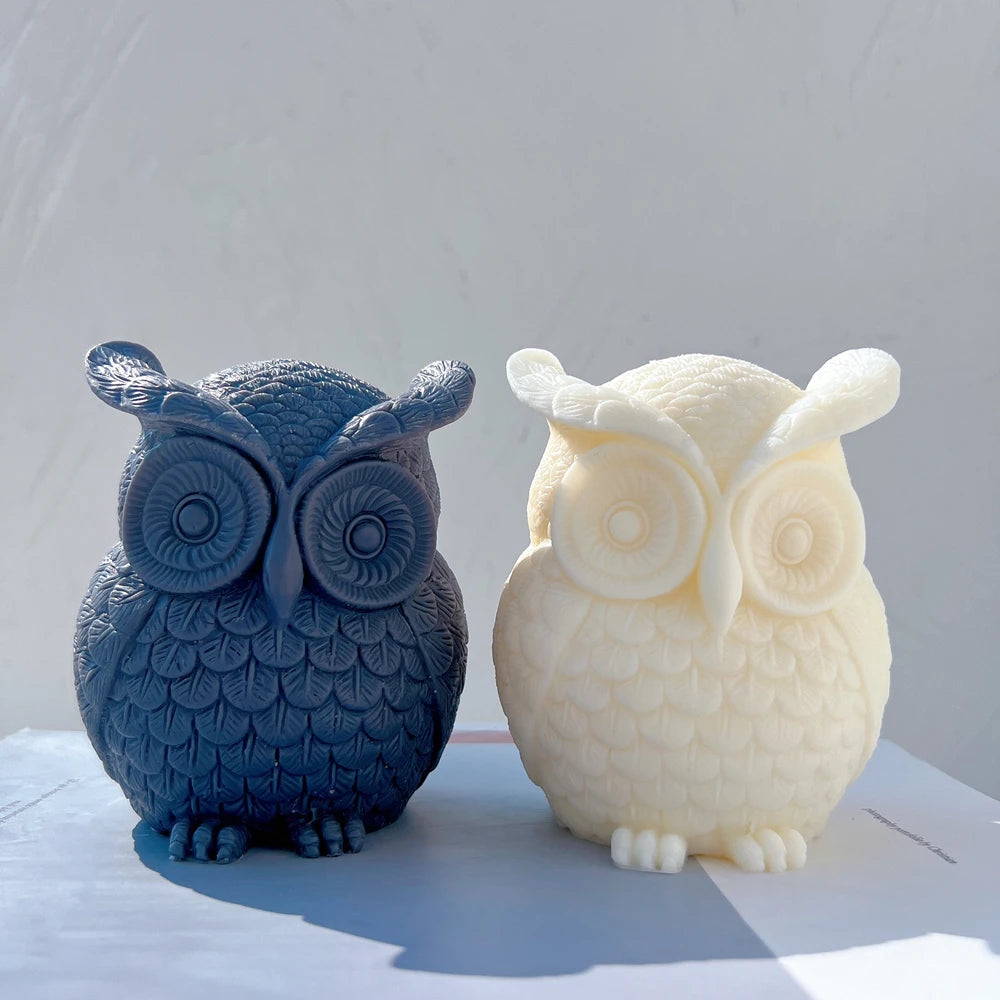 Blue and cream owl candles with large round eyes