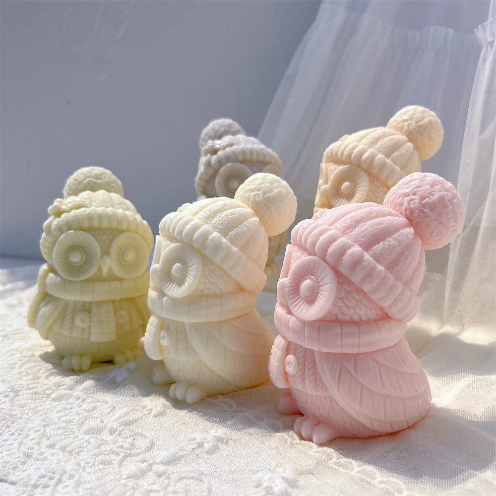 Side views of winter owl candle samples highlighting the scarf and sculpted feathers