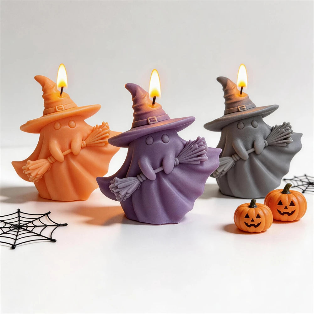 Orange purple and gray ghost witch candles with pointed hats and brooms