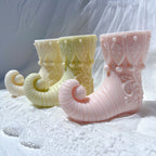 Pastel curled elf boot candle examples