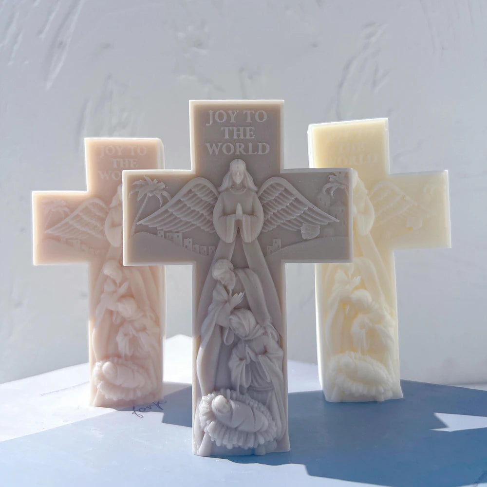 Close view of Joy to the World lettering above an angel and nativity