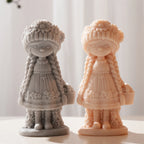 Gray and peach flower girl castings with long braids and flower-trimmed caps