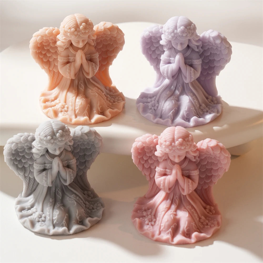 Praying angel girl figurines cast in pastel and peach wax