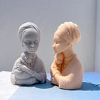 Opposite profile view showing cradling arms and headwrap