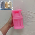 Pink domed lantern silicone candle mold held in one hand