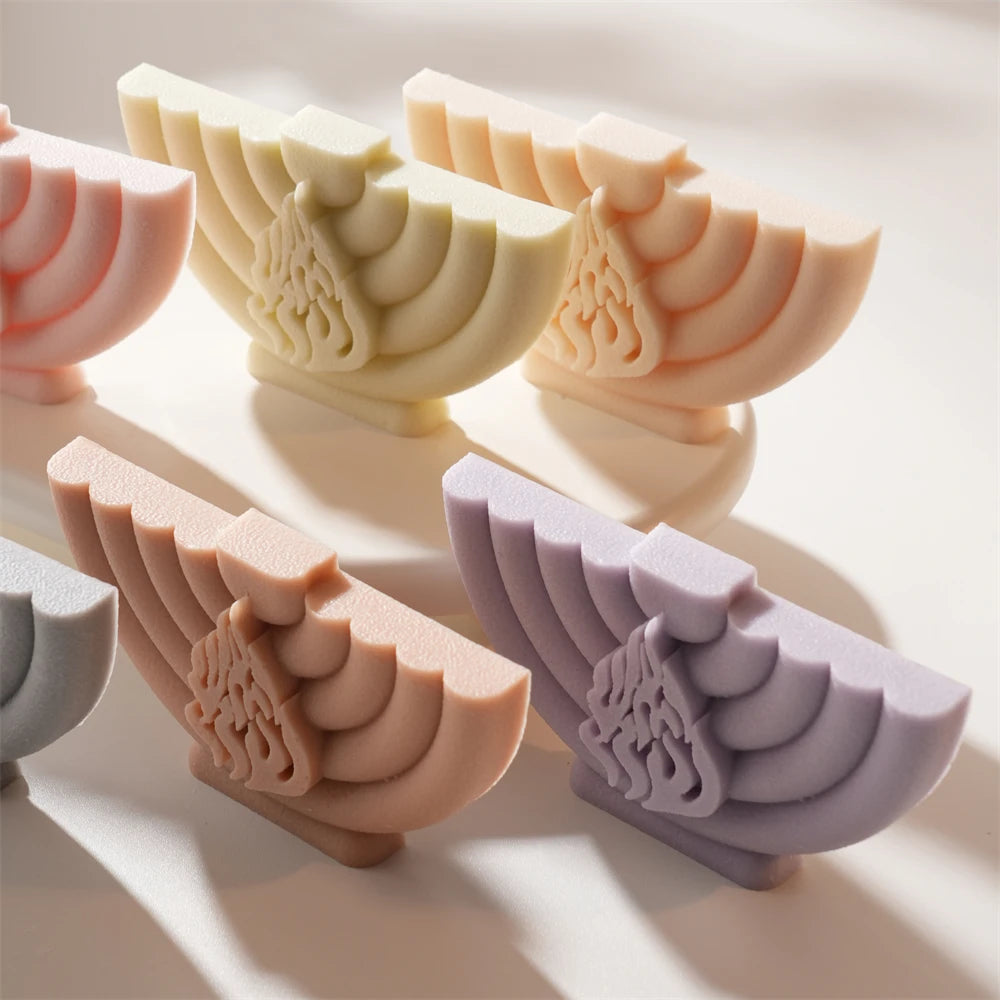 Angled view of solid menorah castings on small bases