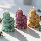 Three seated Santa figures holding reindeer with candle wicks