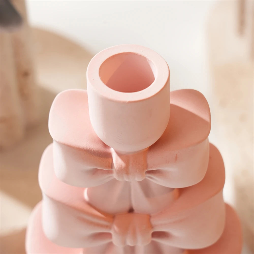 Close view of the cylindrical candle socket above the top bow