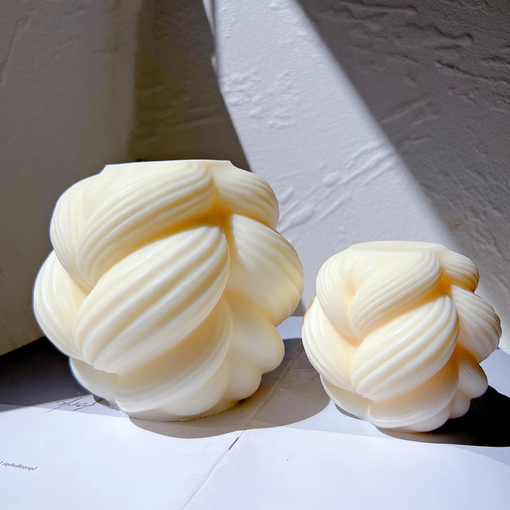 Large and Small braided-swirl castings with overlapping ribbed folds