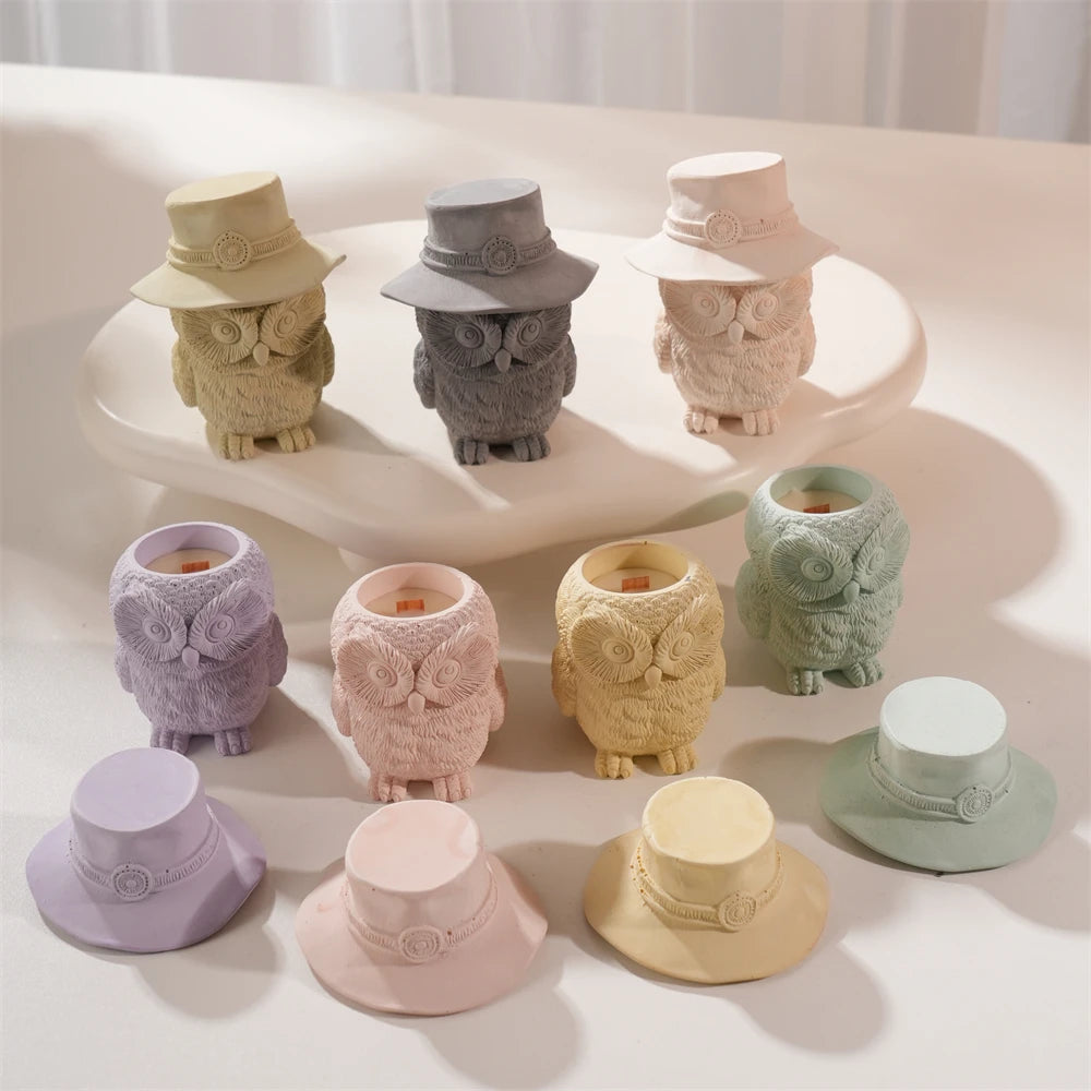 Pastel owl jars with hats removed beside them