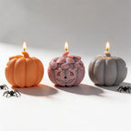 Front and rear views of ghost-topped pumpkin candle samples