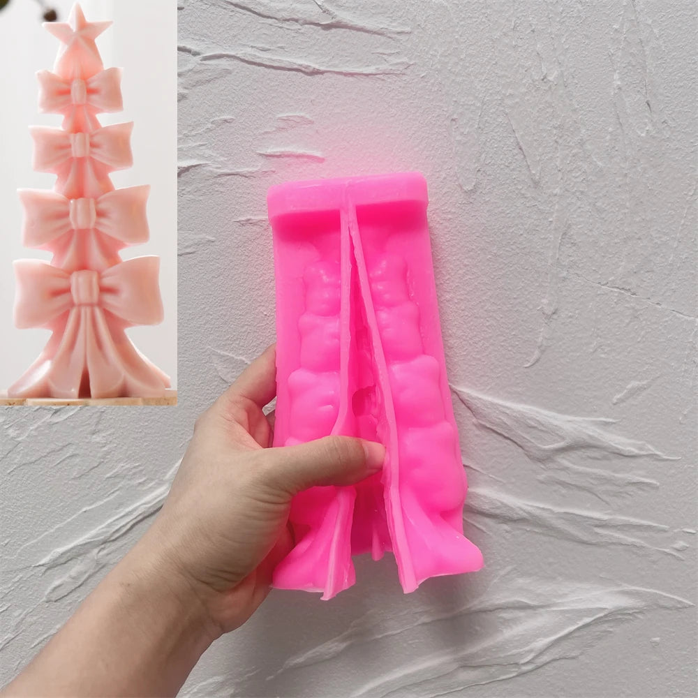 Pink silicone bow-stack tree mold held beside a finished example