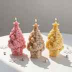 Three textured Christmas tree castings with clustered details and large bows