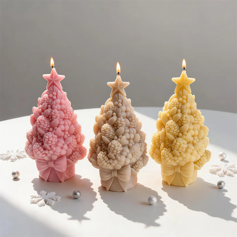 Three textured Christmas tree castings with clustered details and large bows