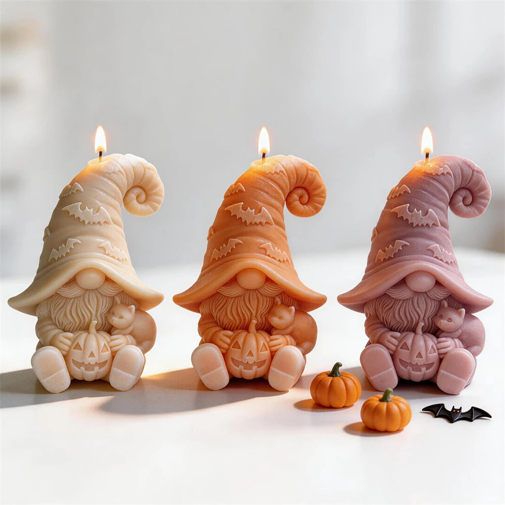 Seated gnome candle samples with bat-pattern hats, cats and jack-o'-lanterns