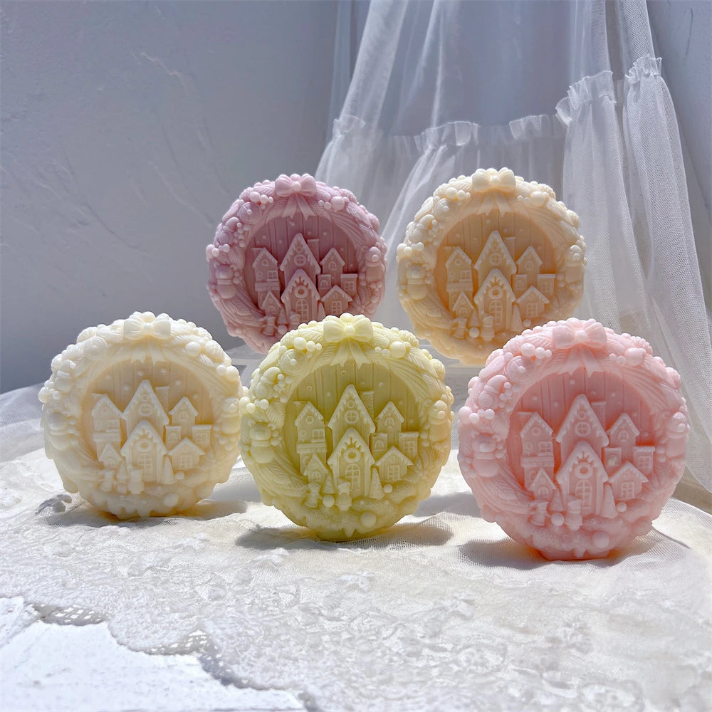 Five winter village medallion castings in pastel colors