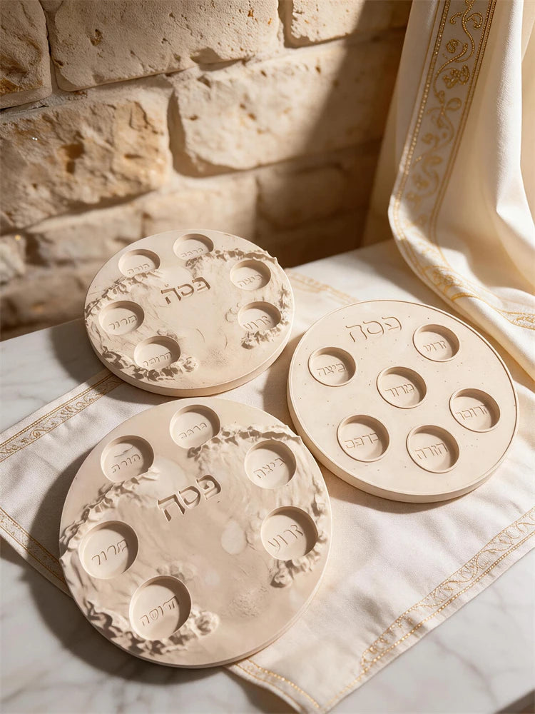Decorative Seder-style plate castings with six wells and Hebrew lettering