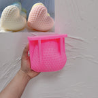 Pink silicone Honeycomb Heart mold held in a hand