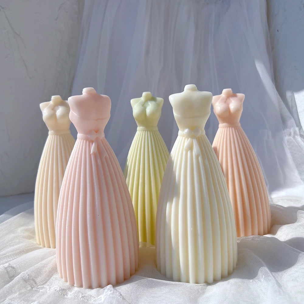 Pleated gown castings standing on fabric