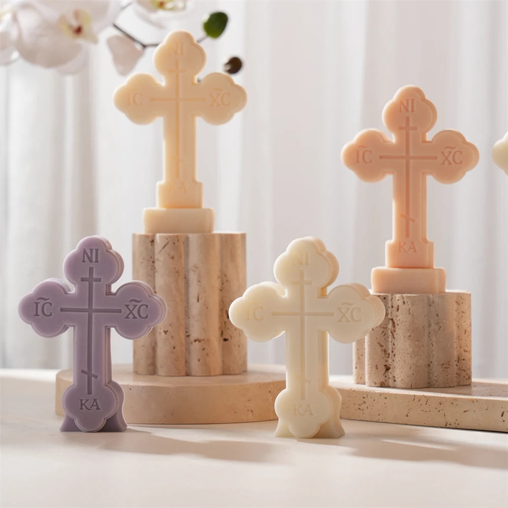 Rounded cross candle castings with embossed lettering