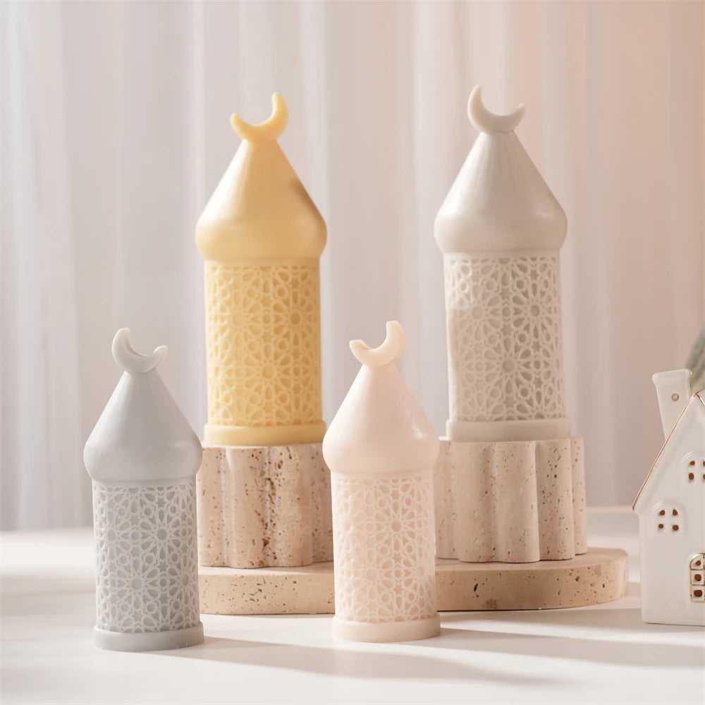 Group of crescent-finial candle castings with patterned cylinders and pointed roofs