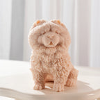 Single peach Chow Chow-style seated dog candle showing front fur detail