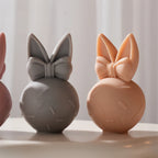 Front views of rounded bunny eggs with small dash marks