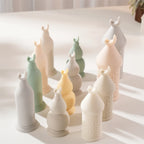 Crescent-topped decorative pillar candles in several colors and standing heights