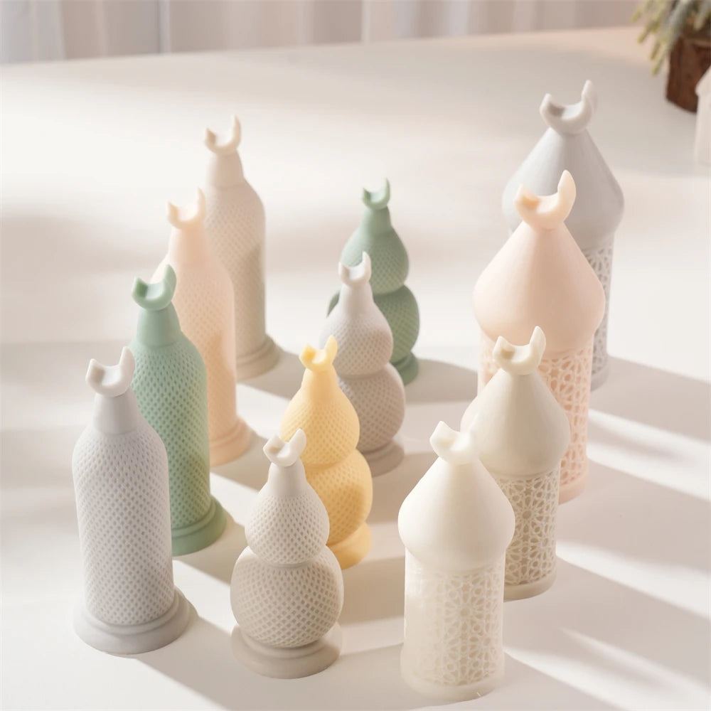 Crescent-topped decorative pillar candles in several colors and standing heights