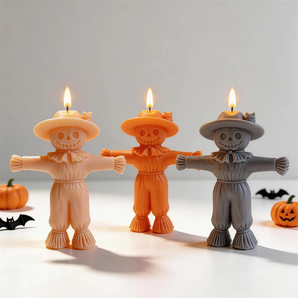 Front view of scarecrow candle samples with round faces and straw-like collars