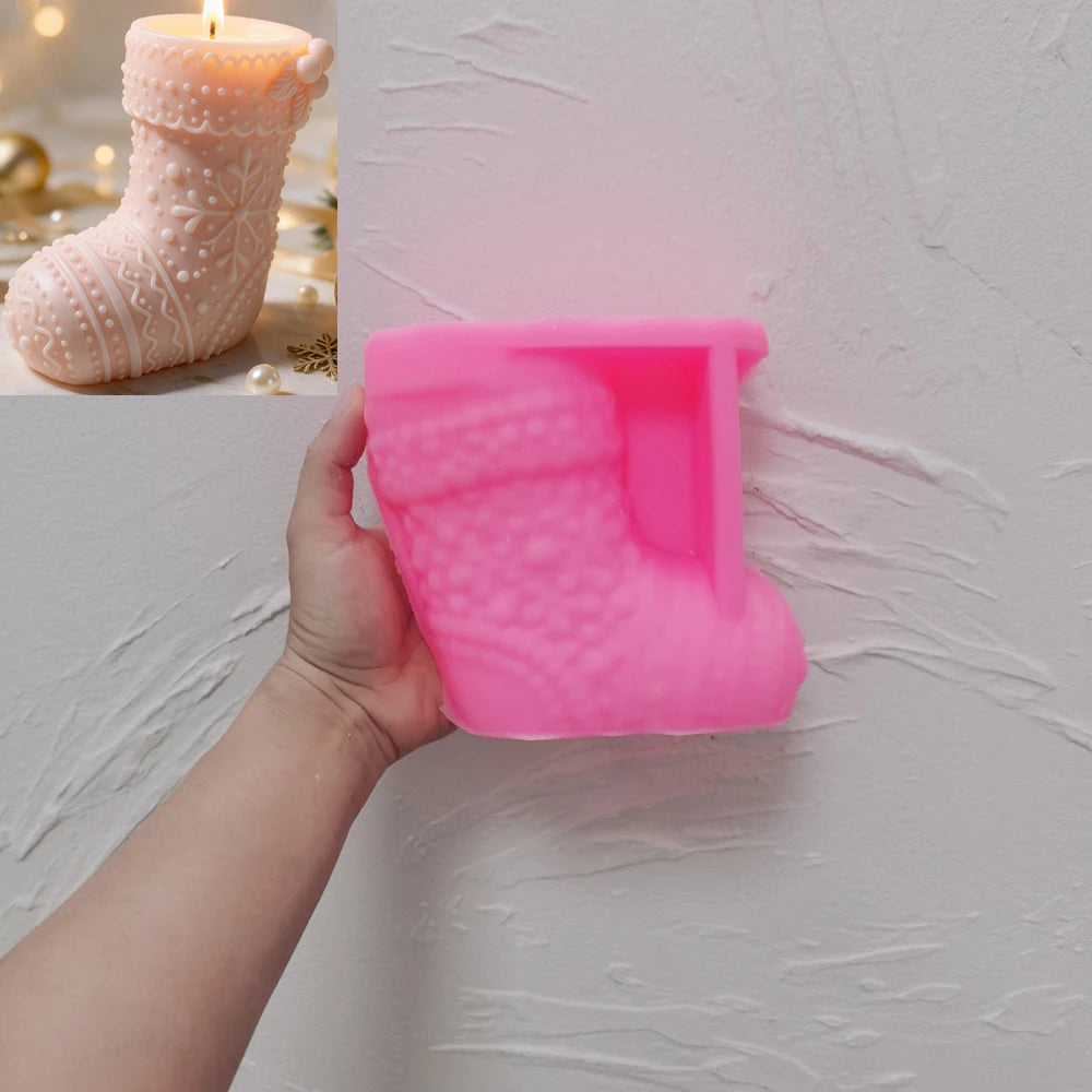 Pink silicone stocking mold with knitted stocking candle inset