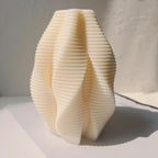 Ivory sculptural wave casting with horizontal ribs and folded sides