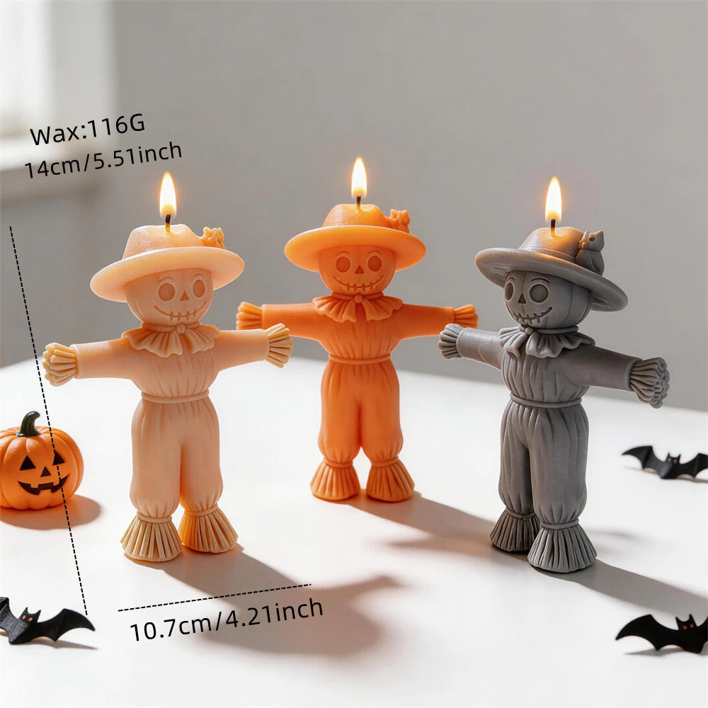 Scarecrow candle measurement diagram with 14 cm height, 10.7 cm arm span and 116 g wax reference